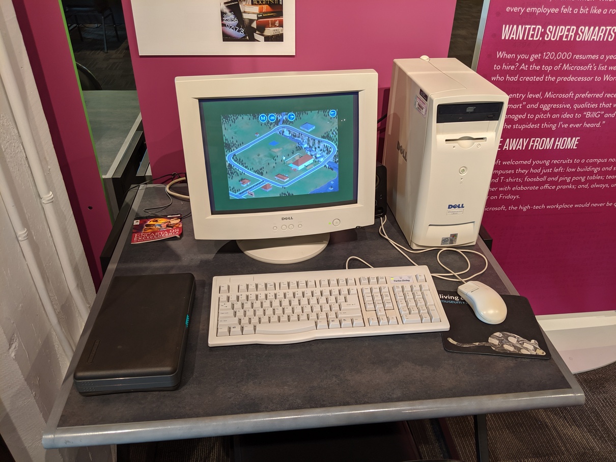 A beige Dell PC with The Sims running.